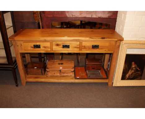 Light oak three drawer console table with undershelf, 81cm by 151cm by 45cm.