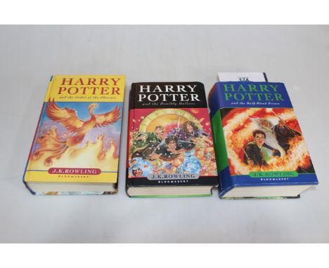 Three first edition Harry Potter books.