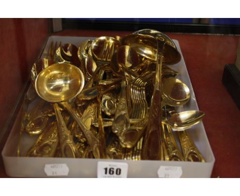 A German gold plated part flatware service, comprising:Ten dessert forksTwelve dessert spoonsTen dessert knivesNine cake fork