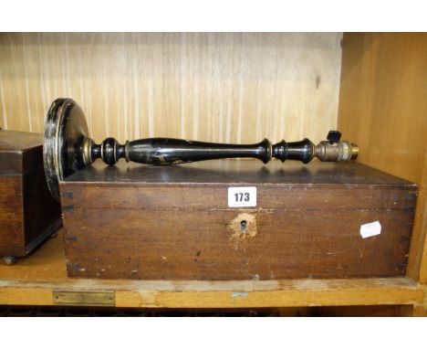 An oak sarcophagus shaped tea caddy, on bun feet, 29cm wide, a rectangular work box, 41cm wide and a table lamp (sold as part