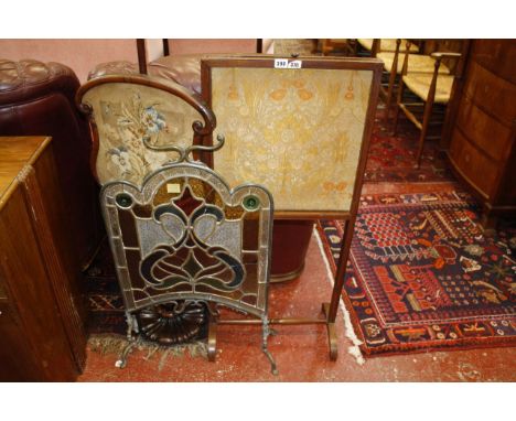 A Victorian rosewood polescreen with inset needlework, a 19th Century mahogany screen with William Morris panel and stained g