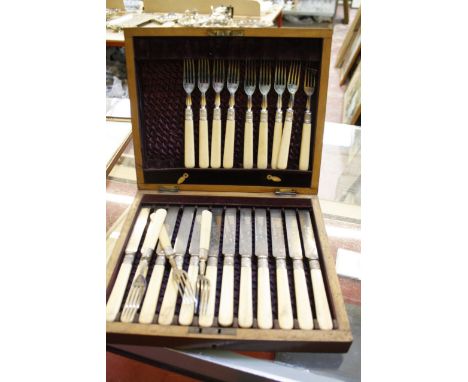 A Silver plate cased set of cutlery, a cigarette case, a ladle and a spill vase