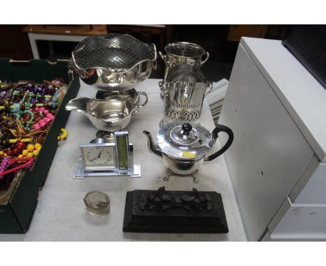 A silver plated rose bowl with lion mask ring handles, silver plated sauce boat, two syphon stands, Art Deco clock and thermo