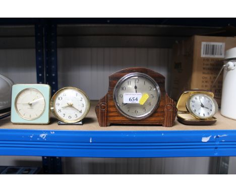 A James Walker Ltd oak cased mantel clock and three Westclox clocks