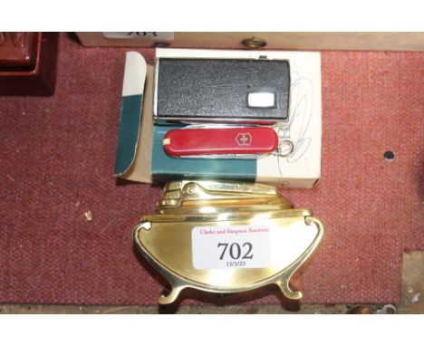 A Ronson table lighter, two other lighters, a pickle fork and a Swiss Army penknife