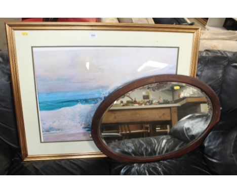 A framed and glazed print and an oval framed bevel edged mirror