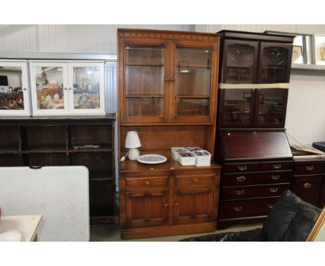 An Ercol dresser raised on cupboard base fitted two drawers