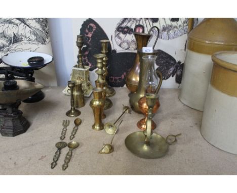 A collection of brass and copper to include candle sticks; chamber stick; vases etc