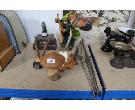 A Harry Potter storage box; a resin model of a wizard; sheet music stand; wooden mushroom ornament; hunting trophies 