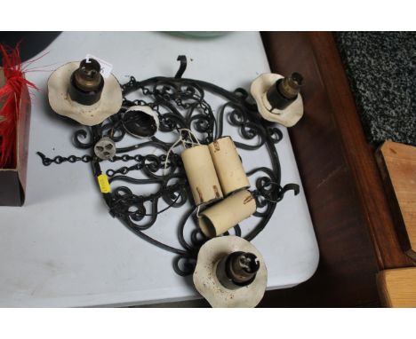 A wrought iron three branch ceiling light
