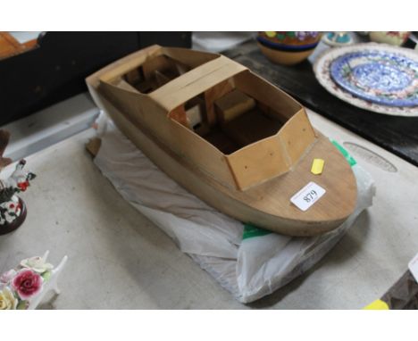 A wooden model boat hull