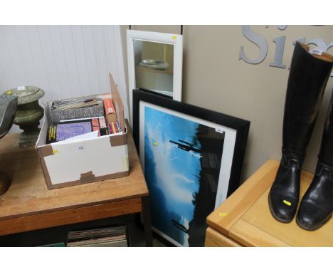 A wall mirror and framed print "Desert Monsoon"