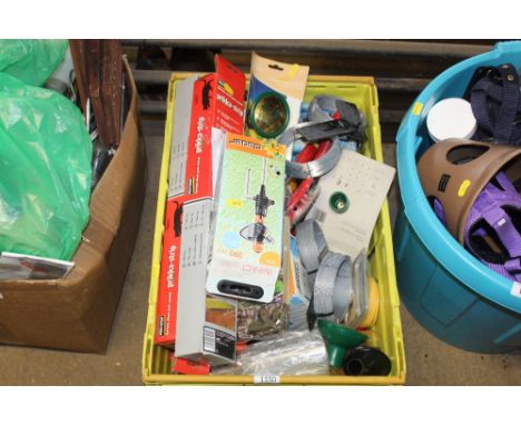 A tray containing various items to include pest control strips; camo cover; hose attachments; hand tools; wire etc