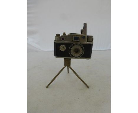 A novelty table lighter modelled as a camera on a tripod, made in occupied Japan, PP13449.