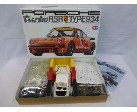 A boxed Tamiya 1/12th scale Porsche turbo RSR Type 934 unassembled model kit. 