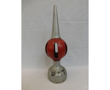 A cast metal railway crossing gate finial.