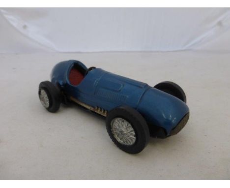 An early Scalextric slot car: a model of a single seater racing car, possibly a Ferrari. 