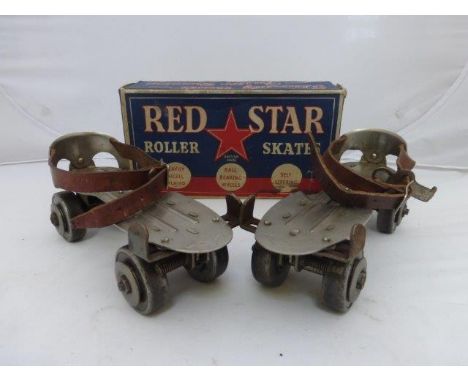 A pair of Red Star roller-skates, in original box. 