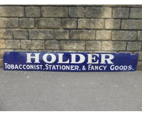 A Holder 'Tobacconist, Stationer & Fancy Goods' rectangular enamel sign, 84 x 12".