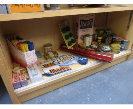 Yesterday's World Museum Grocers - a shelf full of household tins and packaging, including many tins of polish, two Veritas M