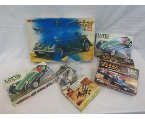 A selection of boxed model kits including Airfix, Tamiya etc; also a selection of tins of model making paint. 