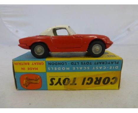 Corgi Toys - Lotus Elan Coupe, no. 319, red with white roof and white interior and a detachable chassis, boxed. 