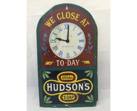 A Hudson's Soap 'We close at ... To-Day' enamel wall clock with extensive repairs and restorations, 10 1/2 x 18".