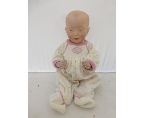 A character doll with painted moulded features and jointed composition body impressed K R 28.
