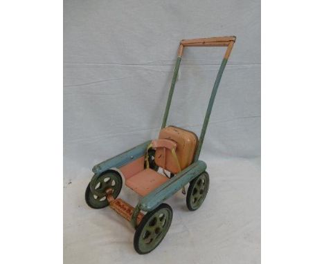 A Mobo Magic dolls pushchair with mechanically adjustable restraint.