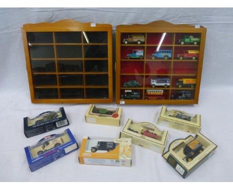 Two wall mounted model car display cabinets, one with assorted model contents and seven boxed Lledo 'Days Gone' models. 