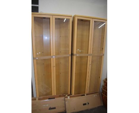 Pair of light wood corner display cabinets