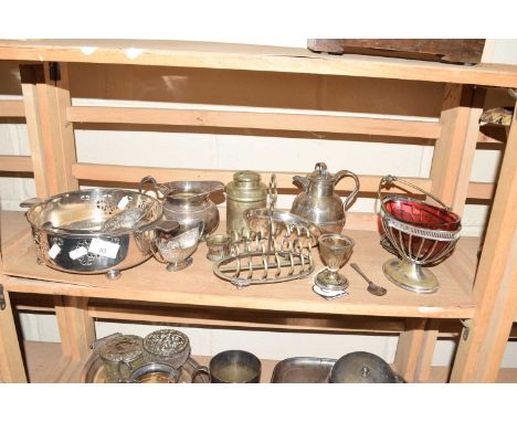 Mixed Lot: Various silver plated wares to include a Channel Islands cream jug, a glass mounted sugar basin, toast rack and ot