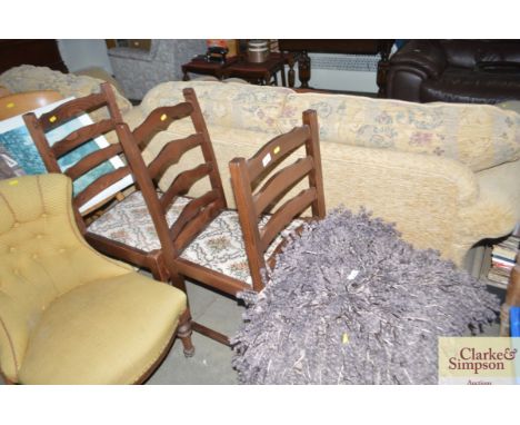 Three ladder back dining chairs