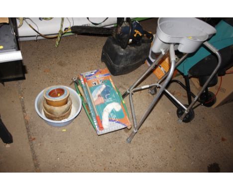 A quantity of planters and a trug of various hand tools and a mobility walker