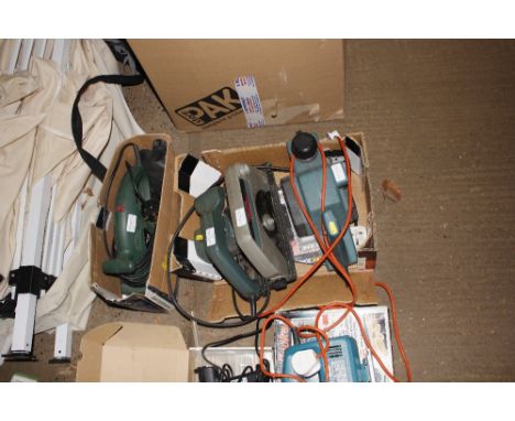 A box containing an electric planer together with a rip saw and a box containing an orbital sander