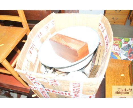 A box containing various sundry items to include an enamel bowl
