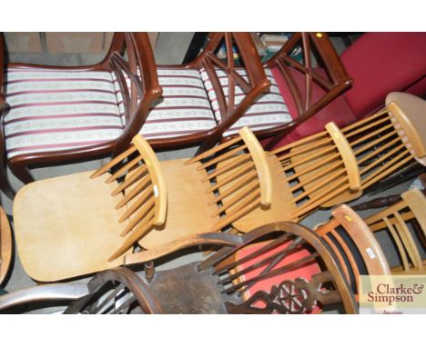 A set of four stick back beech chairs