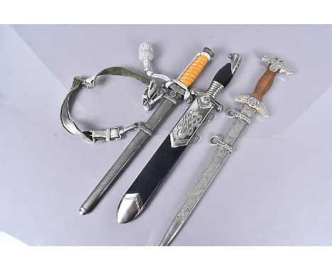A Group of three reproduction German daggers, comprising Army, RAD and another form own opinion before bidding