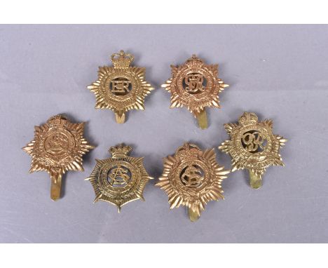 Royal Army Service Corps (RASC), six badges, comprising of a Victorian brass example with loops, an 01/19 with slider, a WWI 