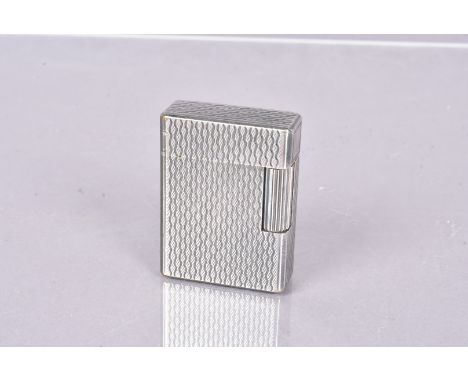 An S.T Dupont lighter, silver plated, with engine turned design, serial D4JG18 