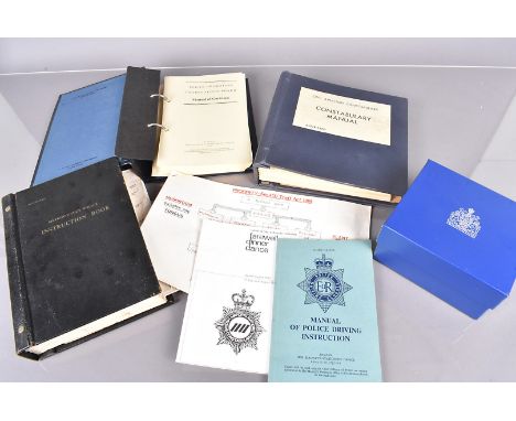 An assortment of 1970s/1980s Metropolitan Police uniform items, to include Traffic Police Hi-Viz jacket, an outer jacket, a w