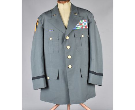 A US Army uniform, comprising of Jacket (size 43XL) with large medal board to chest, OD Jungle patch to sleeve and Army Colle