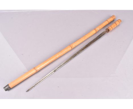 A late 20th Century sword stick, the bamboo style shaft with 56cm long triform blade 