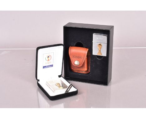 A 1998 Football World Cup Collector's Edition Zippo Lighter and Pouch set, 3218/5000, together with a 2002 Limited Edition Fi