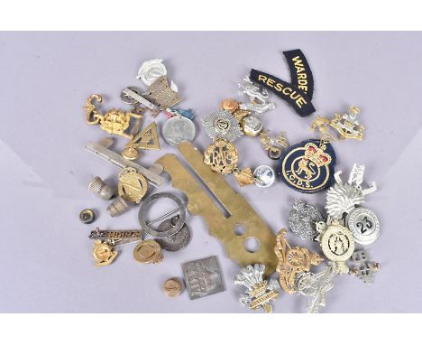 A collection of cap badges and other items, comprising two 27th Lancers, one being bi-metal, The Leinster Regiment, 23rd Regi