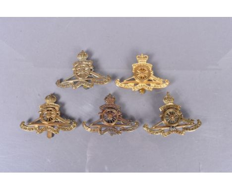 Royal Artillery (RA), five badges, comprising an 02/53 example, a WWI brass example, a 53/56, a Territorial Army example with