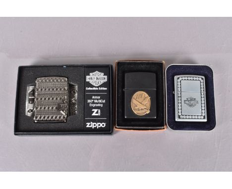 A 2021 Harley Davidson 360 degree Armor engraving Zippo lighter, together with a 2003 Harley Davidson Zippo and one other (3)