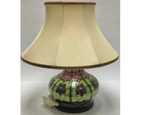A Moorcroft compressed ovoid lamp base, tube lined with violets in a geometric arrangement, Moorcroft shade, 40cm overall 