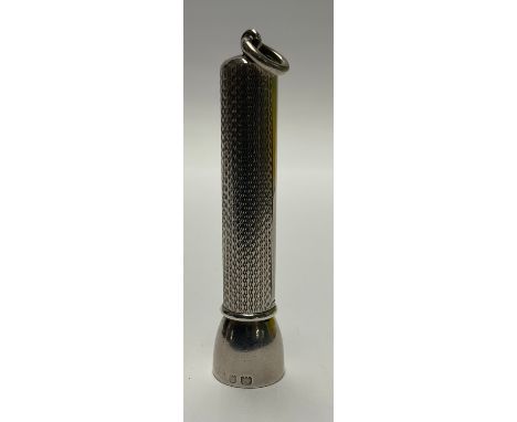 A George V silver cigar piercer, engine turned, 7cm over suspension loop, Sampson Morden and Co. London 1929, 19g