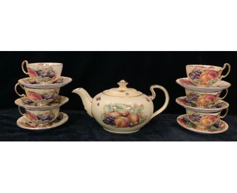 An Aynsley Orchard Gold pattern teapot set of six Aynsley Orchard Gold pattern teacups and saucers, 